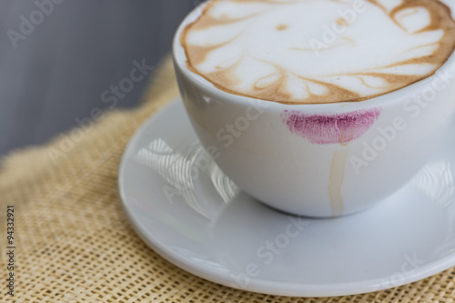Coffee stains lipstick purple color on cup