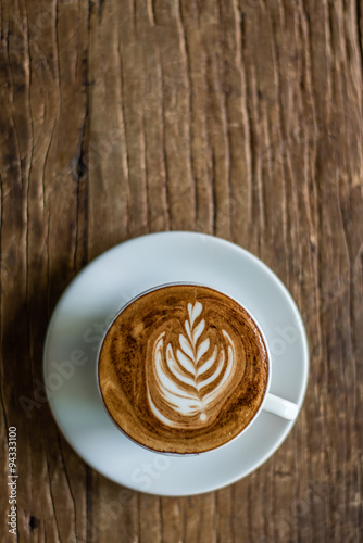 Latte Art on Wooden Background