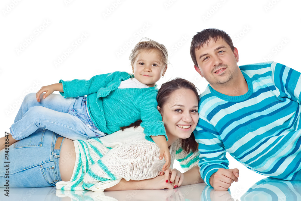 Happy family with daughter in studio, white background Happy family with daughter in studio, white background
