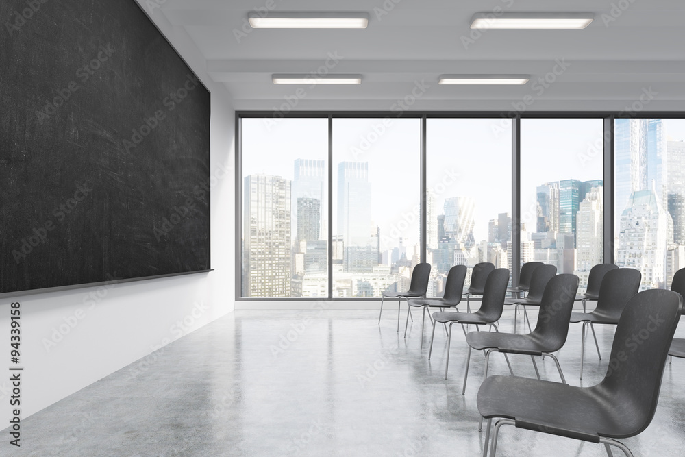 A classroom or presentation room in a modern university or fancy office. Black chairs, a black chalkboard on the wall and panoramic windows with New York view. 3D rendering. - obrazy, fototapety, plakaty 