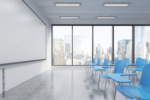 A classroom or presentation room in a modern university or fancy office. Blue chairs, a whiteboard on the wall and panoramic windows with New York view. 3D rendering. © ImageFlow