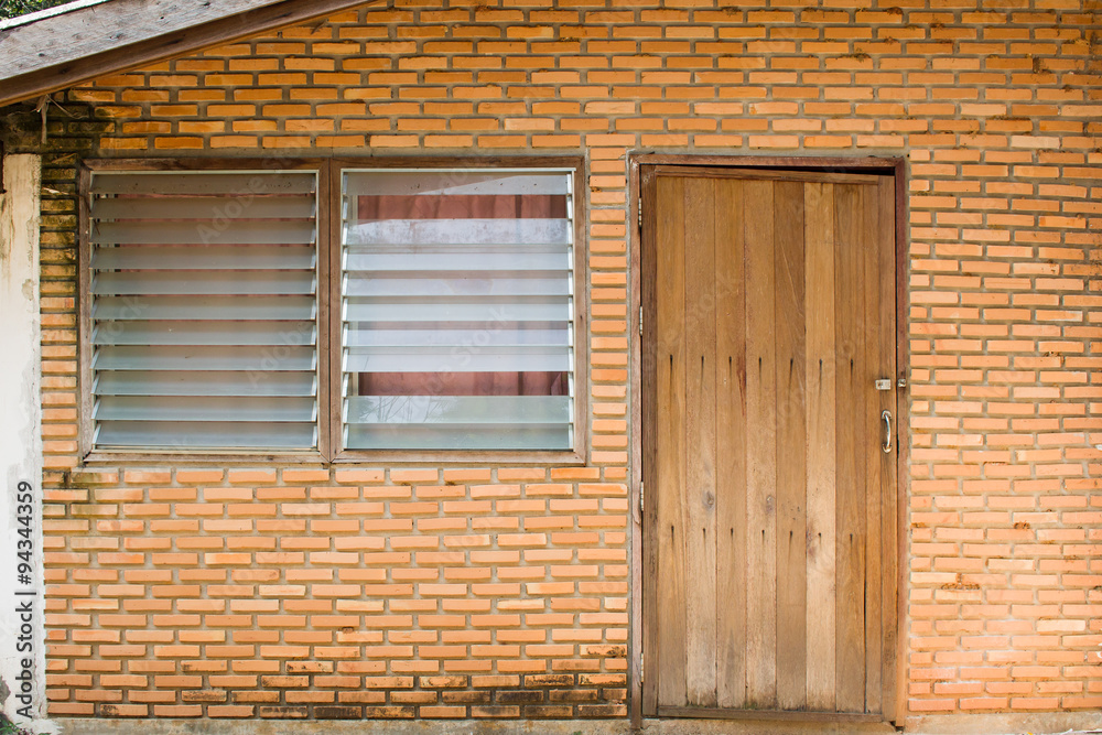 old wall, door and window of front house