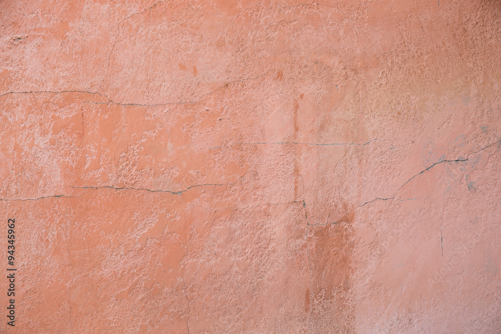 Pink clay wall of old house