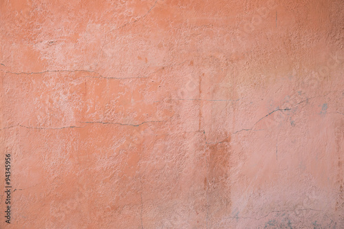 Pink clay wall of old house