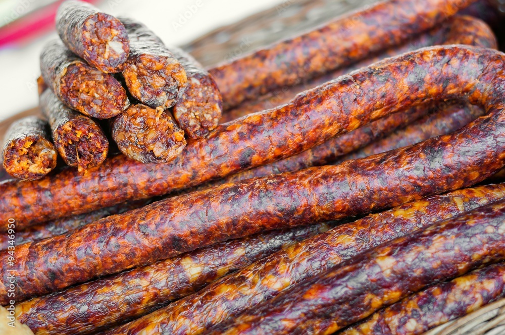 Fototapeta premium Homemade delicious smoked sausages in market. Traditional food