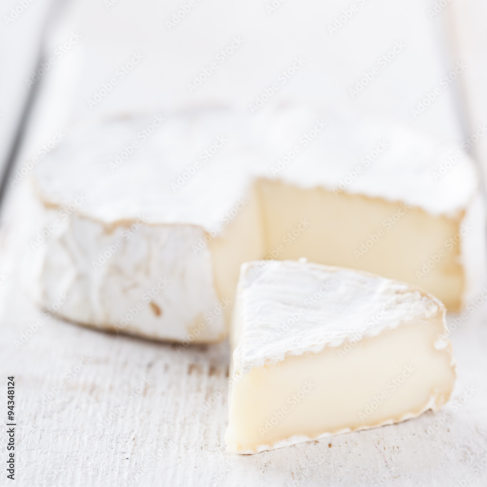 Brie cheese on white background.selective focus.
