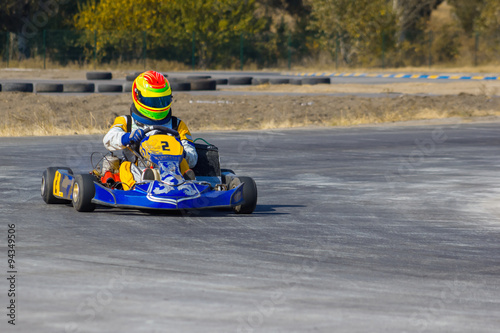 Karting - driver in helmet on kart circuit © master1305