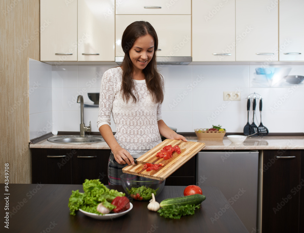 happy girl prepare salad