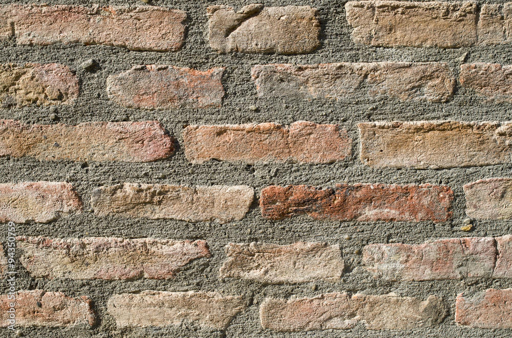Naklejka premium Wall of old brick house closeup