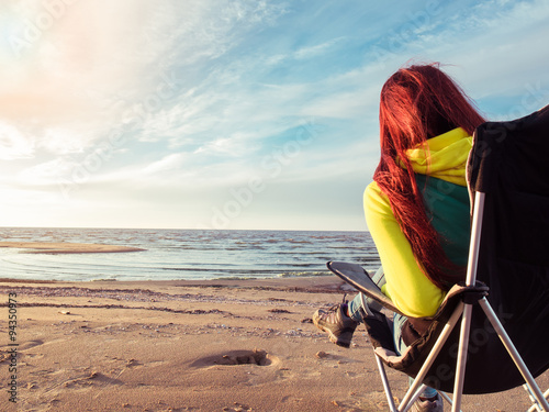 woman resting on beach photo