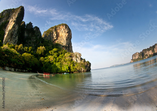 Long tail boat at the beach in Railay Beach Thailand and rock i