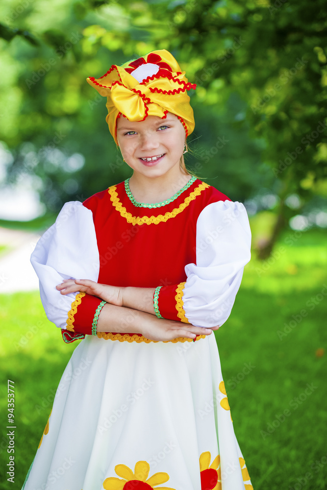 Little girl is dressed in the Russian national dress in summer p Stock ...