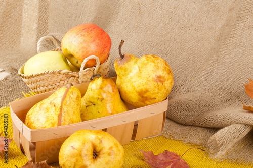 Yellow pears and pink apples photo