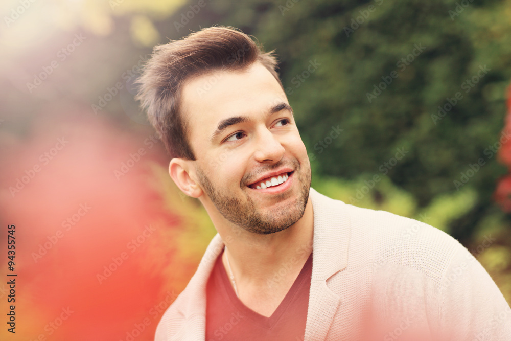 Young happy man in the park in autumn Young happy man in the park in autumn