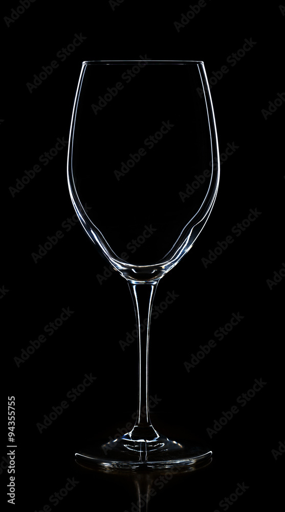 Empty white wine glass on a black Empty white wine glass on a black