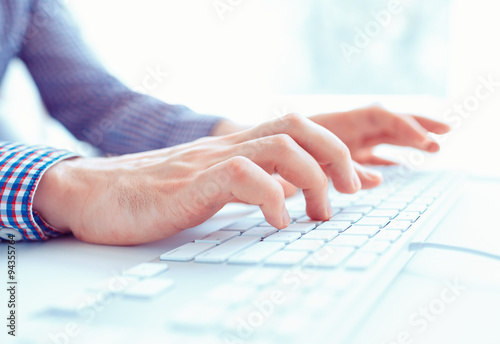 Male hands or men office worker typing on the keyboard