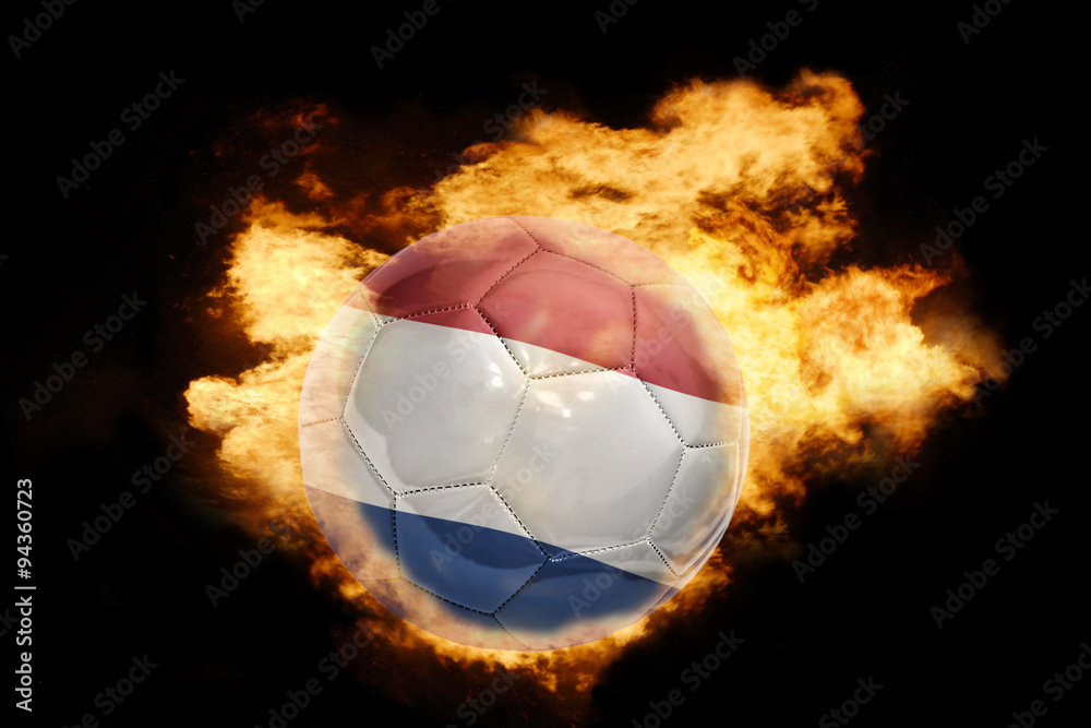 Fototapeta premium football ball with the flag of netherlands on fire