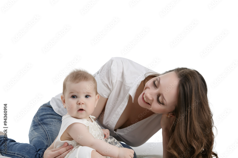 Happy dark-haired mother playing with her baby Happy dark-haired mother playing with her baby