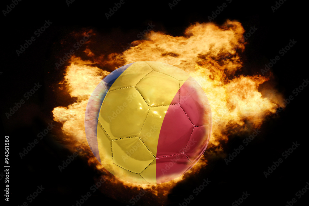 Fototapeta premium football ball with the flag of romania on fire