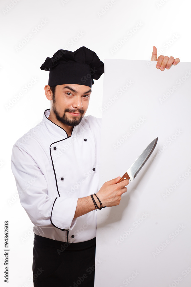 handsome cook in uniform and hat gesturing with big knife handsome cook in uniform and hat gesturing with big knife