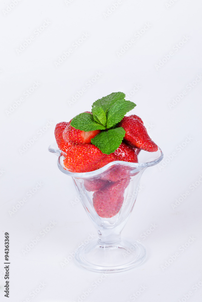strawberriesglass bowl with mint white background isolation