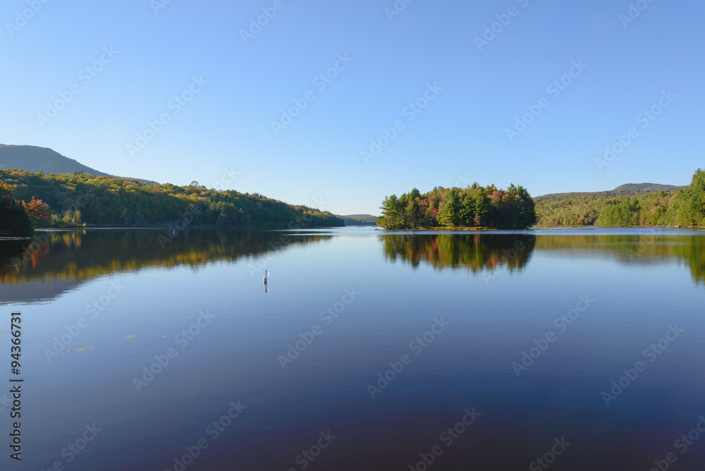 Autumn forest and lake with reflection