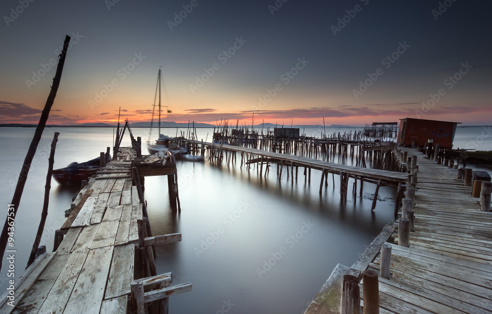 Twilight at an ancient fishing dock Stock Photo