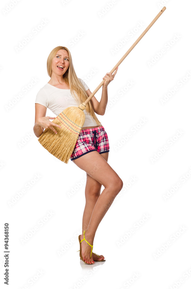 Young woman with broom isolated on white Young woman with broom isolated on white