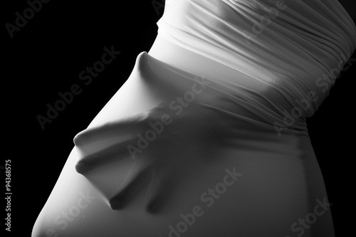 Screaming human hands pressing through fabric as horror background