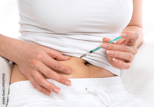 Diabetes patient insulin shot by syringe with dose of lantus