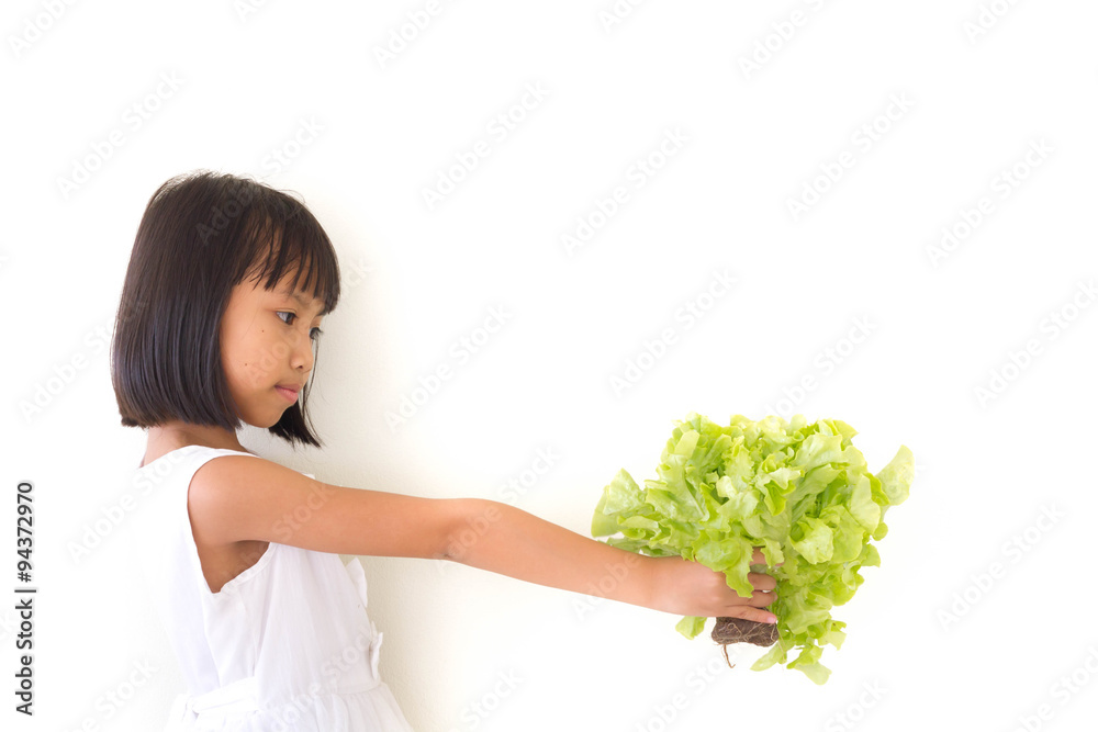 Children girl is expressions of healthy food on white background Children girl is expressions of healthy food on white background