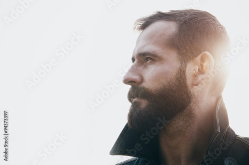 portrait of handsome bearded man in sunlight