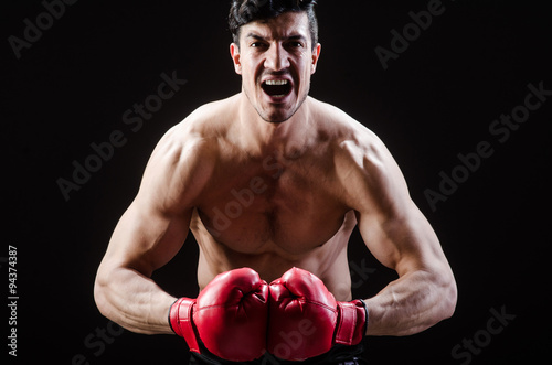 Muscular man in boxing concept © Elnur