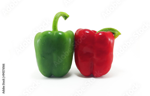 Red and green bell pepper on white background