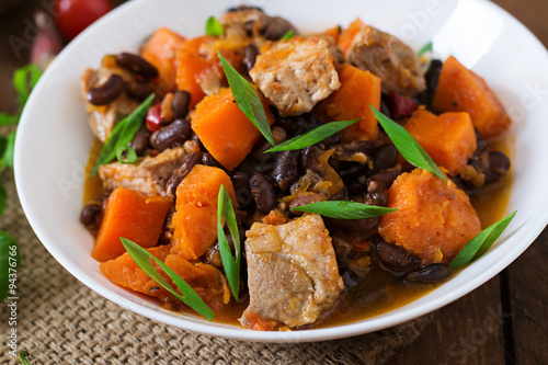 Baked spicy pumpkin with meat and beans