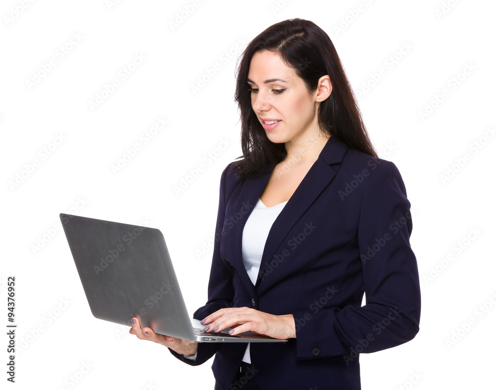 Businesswoman look at the notebook computer Businesswoman look at the notebook computer