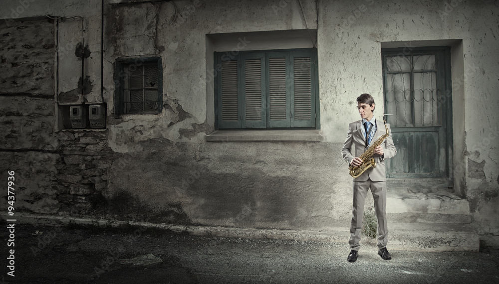 Handsome saxophonist. Concept image Handsome saxophonist. Concept image