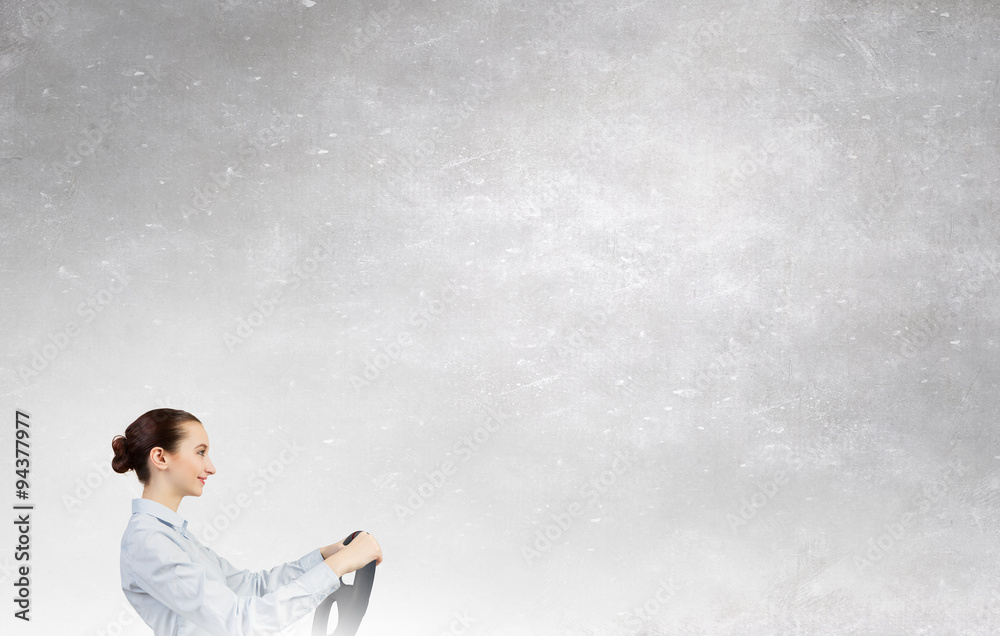 Woman with steering wheel