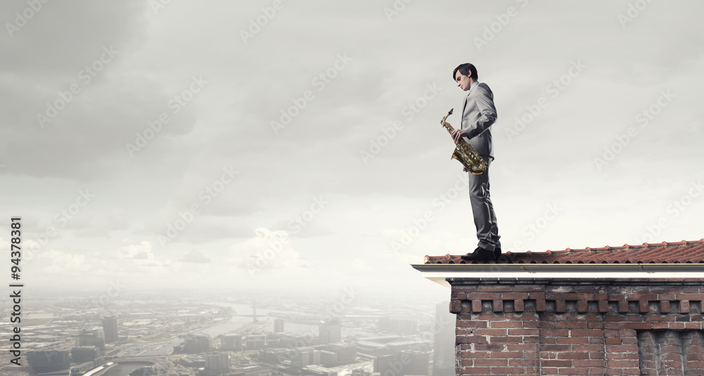 Handsome saxophonist. Concept image Handsome saxophonist. Concept image