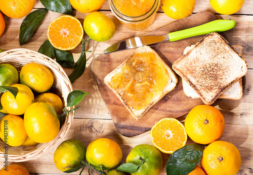 Fototapeta Naklejka Na Ścianę i Meble -  toast with orange mandarin marmalade with fresh fruits