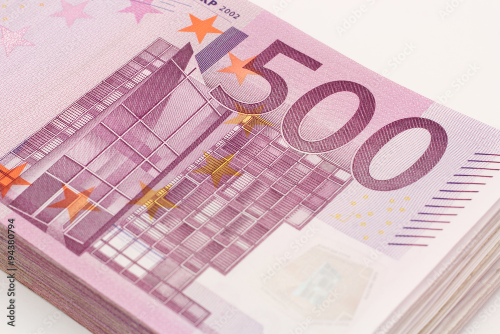 Money - Isolated stack of Five hundred (500) euro bills banknotes with white background Money - Isolated stack of Five hundred (500) euro bills banknotes with white background