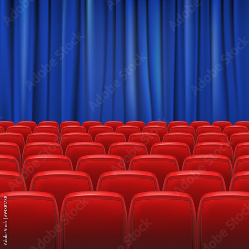 Red seats in hall with curtain