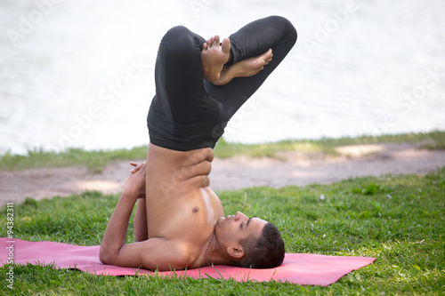 Vászonkép Upward Lotus pose in park