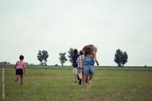 children playing in a field © virythtpehjljd89
