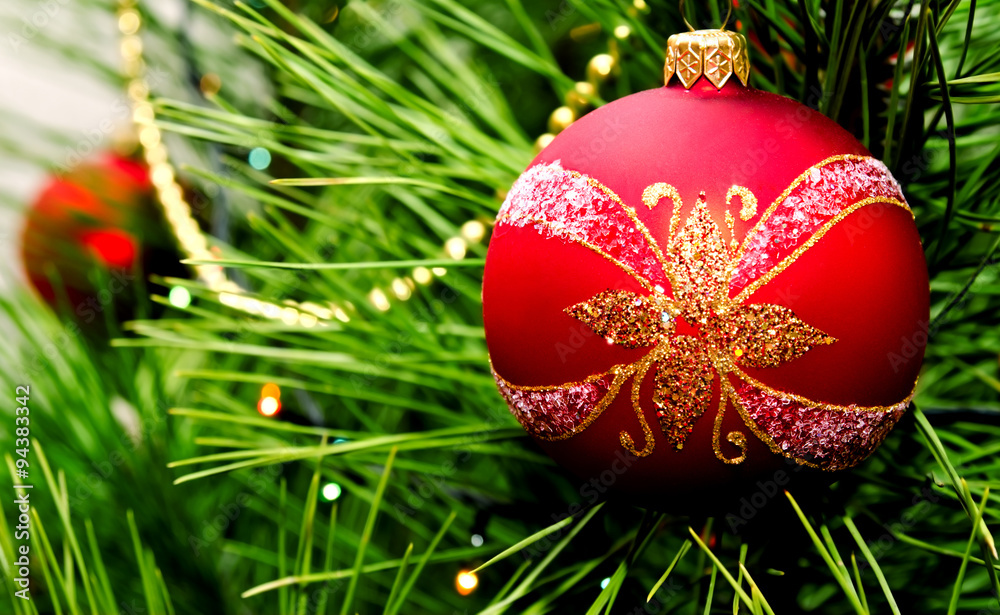 Christmas ball hanging on fir tree