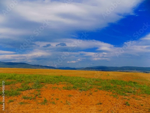 Field, hills and sky
