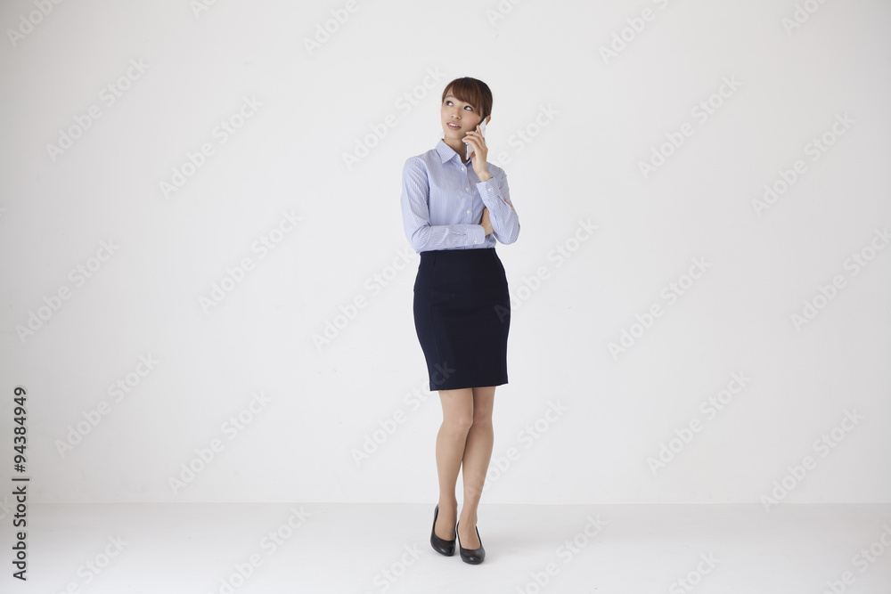 Female employees are talking on a mobile phone Female employees are talking on a mobile phone