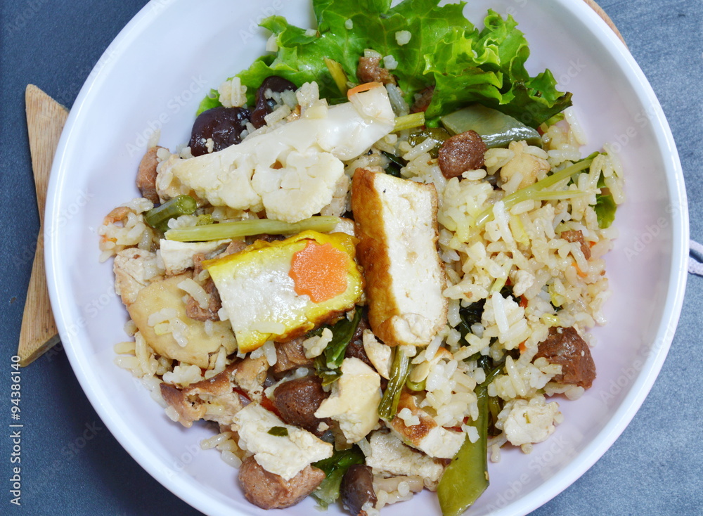 vegetarian fried rice with vegetable and tofu on bowl vegetarian fried rice with vegetable and tofu on bowl