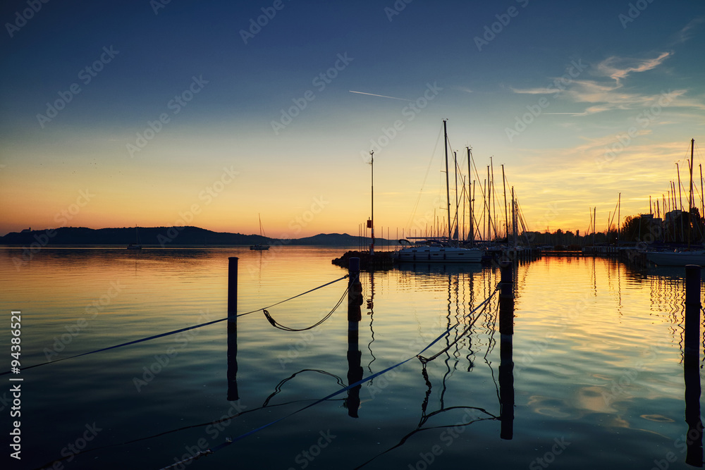 Boats on dock sunset