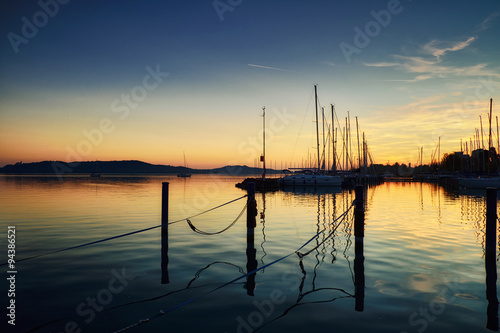 Fototapeta Naklejka Na Ścianę i Meble -  Boats on dock sunset